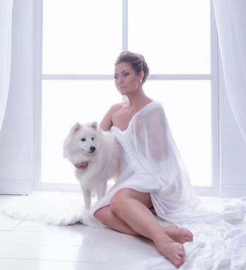 Woman with a serene expression focusing her sight on a distant point.